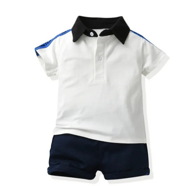 boys white and navy polo shorts set with black collar and blue stripe detail, toddler size
