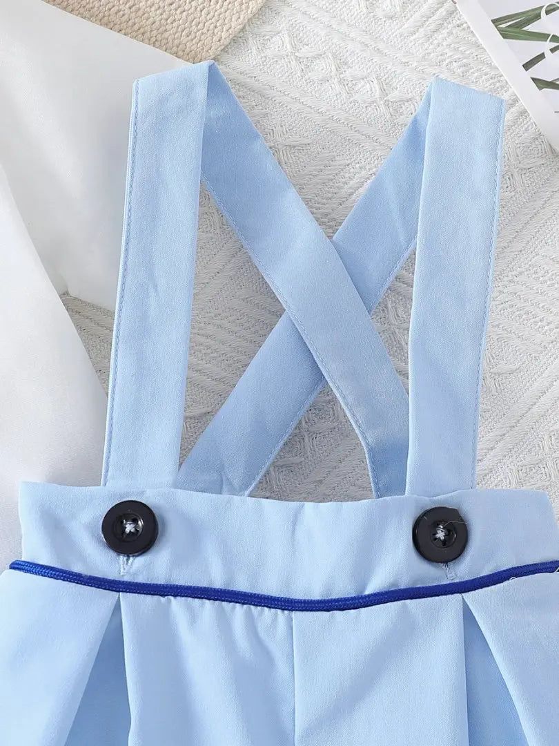 baby blue preppy clothing suspender skirt with black buttons and crisscross straps for toddlers