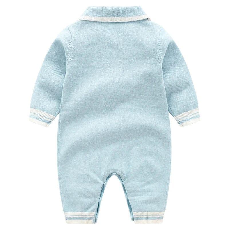 Light blue preppy knit romper for babies with white trim collar and cuffs, long sleeve