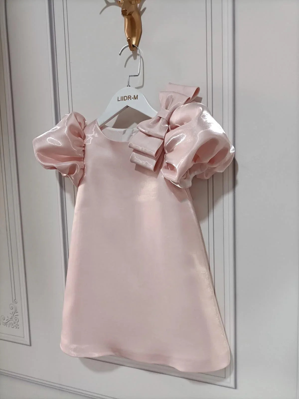 princess pink party dress for little girls with puff sleeves and bow detail, toddler size