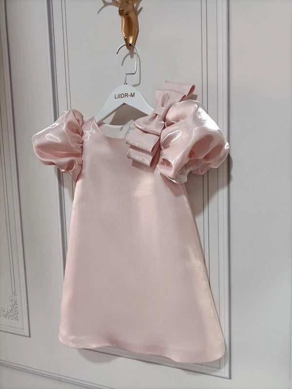 princess pink party dress for little girls with puff sleeves and bow detail, toddler size