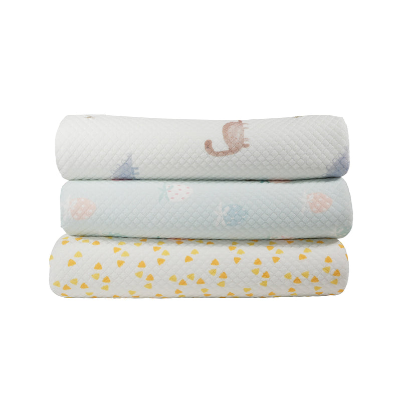 Three Strawberry Pattern Printed Knit Blankets stacked together, featuring various playful patterns perfect for a baby's nursery.