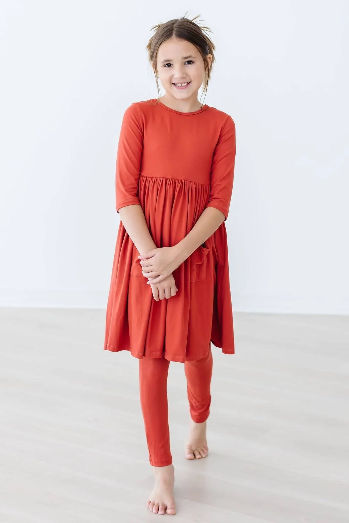 Girls pumpkin spice twirl dress for girls in orange with 3/4 sleeves and gathered waist by Mila & Rose