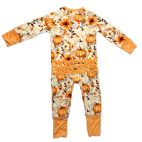 Children's onesie with pumpkin and floral pattern on a white background