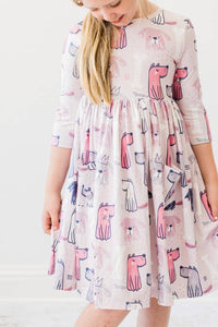 young girl wearing pink Mila Rose puppy party dress for girls twirl pocket dress 