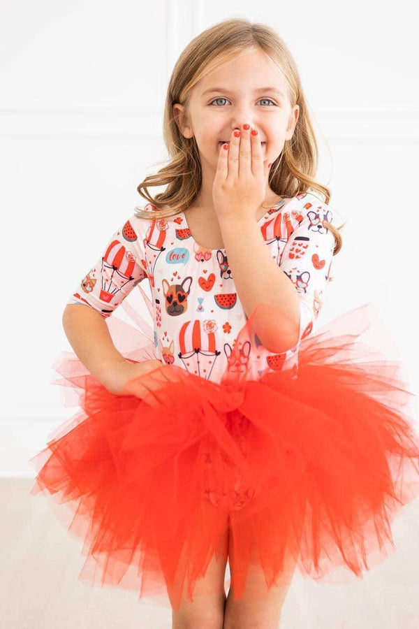 Girl wearing red puppy print tutu leotard for girls with sleeves
