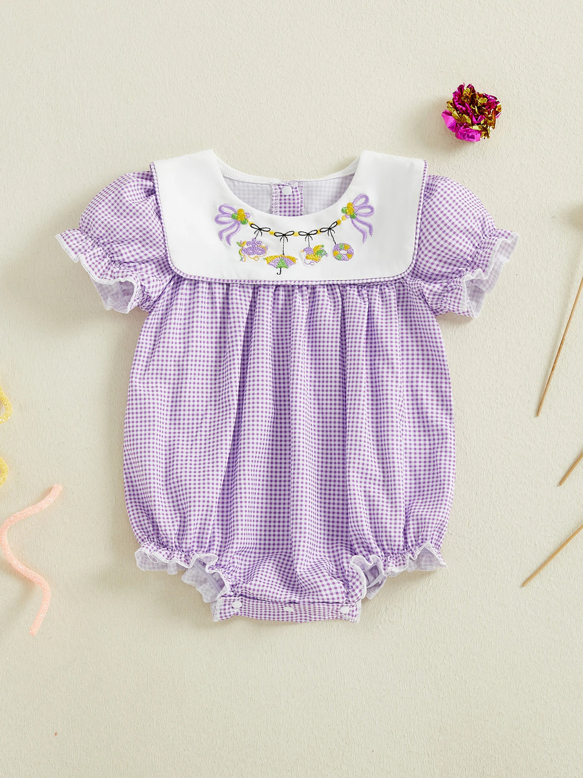 Purple embroidered baby bubble romper with checkered pattern and floral detail for infants