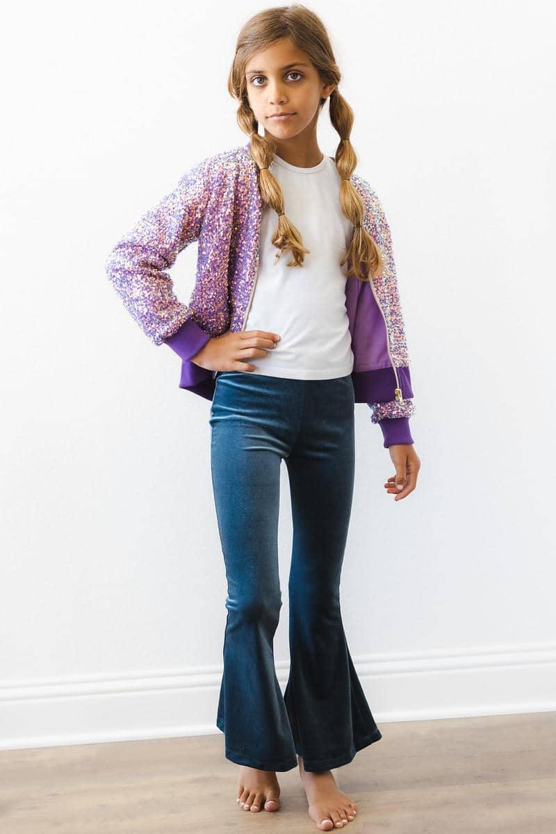 girl wearing purple sequin jacket for kids standing with hand on hip and braided hair