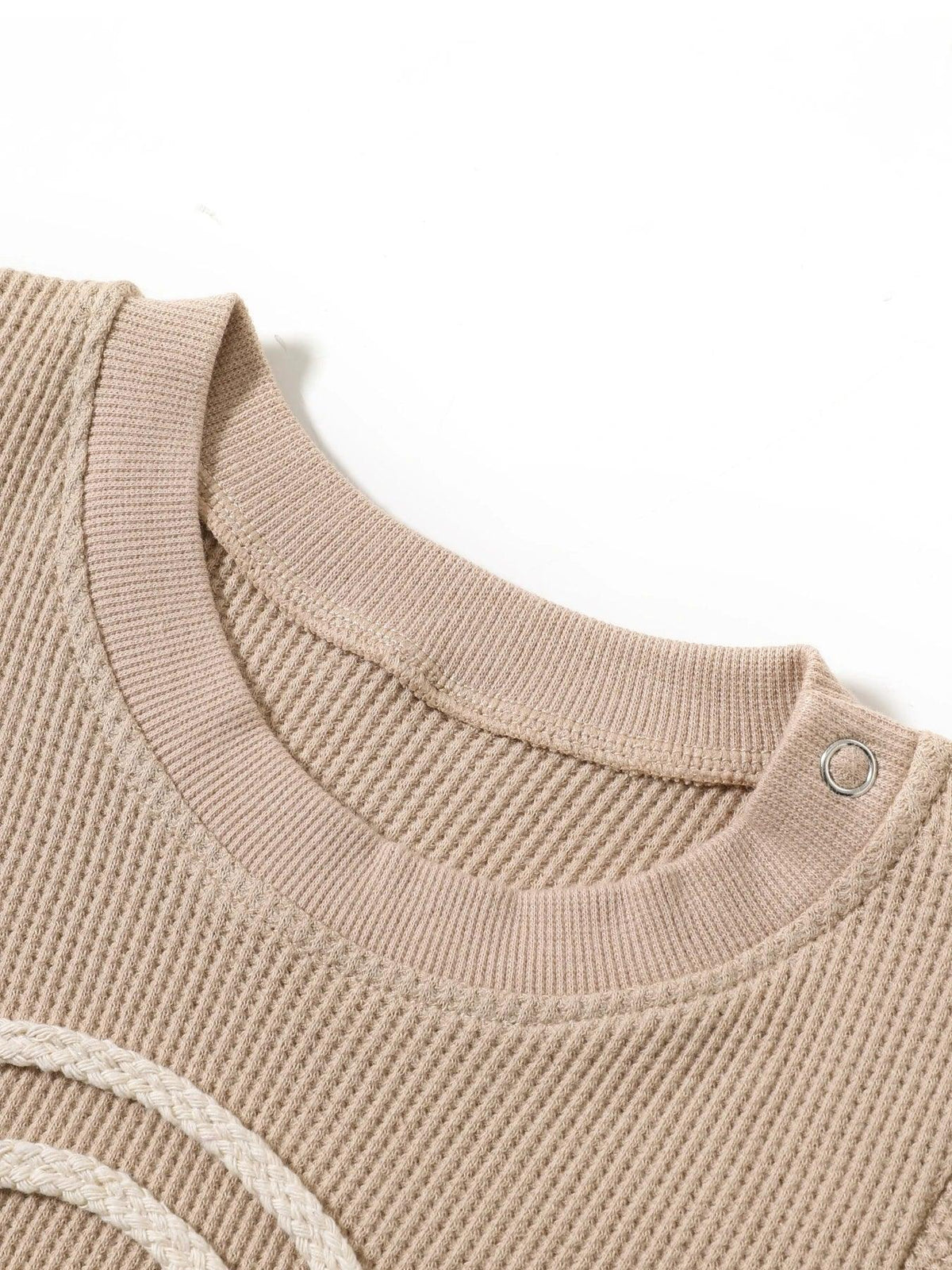 beige baby romper with textured knit fabric and snap button on shoulder for easy dressing rainbow baby romper