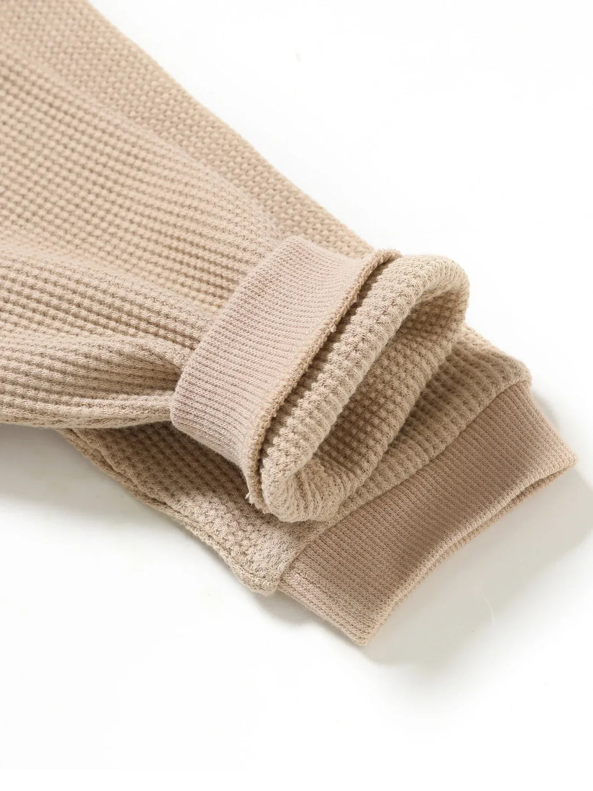 Beige waffle knit baby romper sleeve detail with ribbed cuffs for infants rainbow baby romper