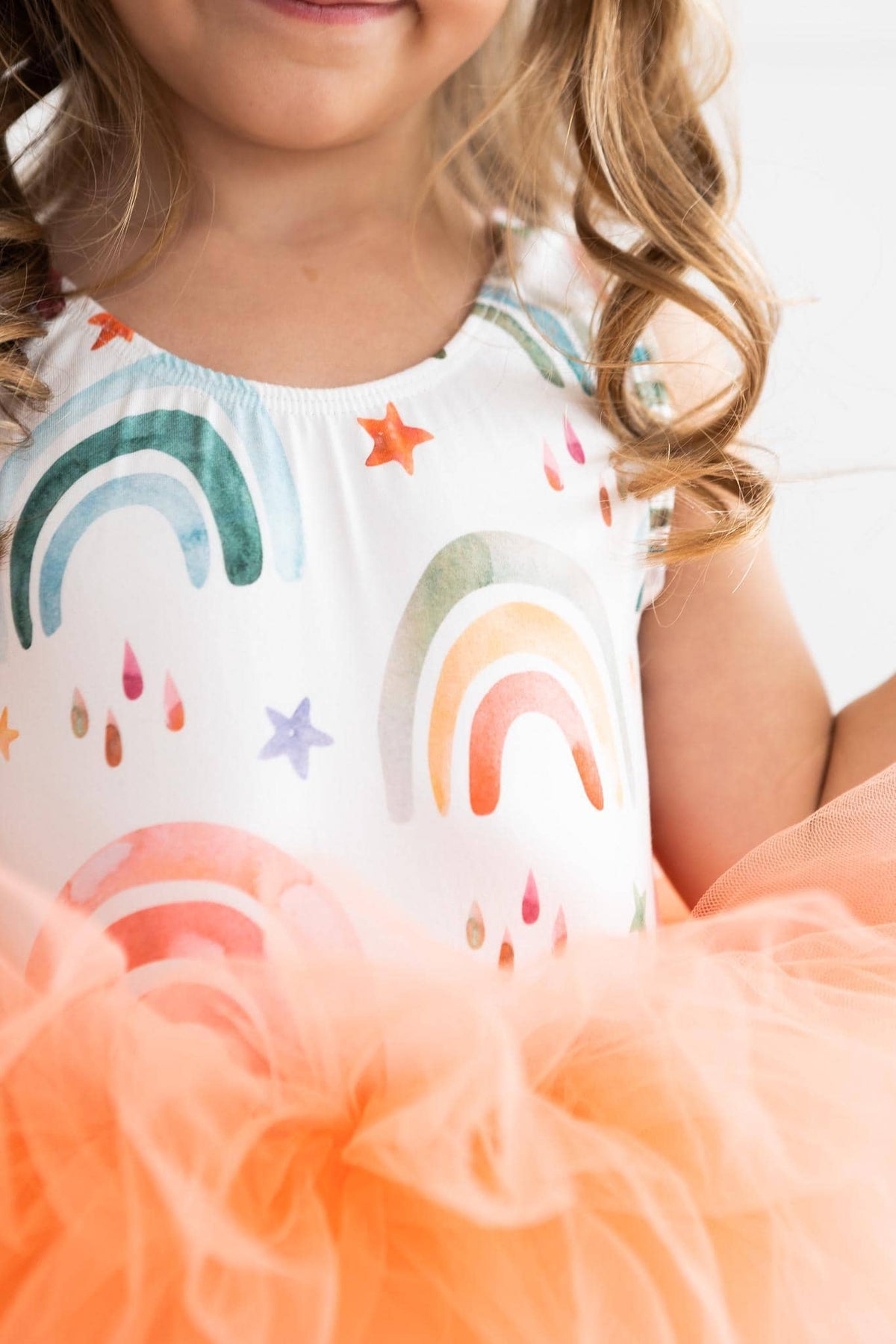 Girls rainbow tutu leotard for girls by Mila & Rose with colorful rainbows and orange tulle skirt