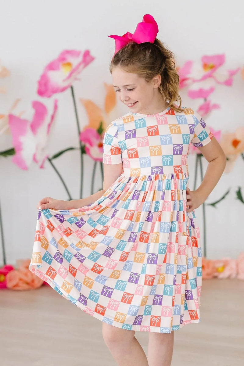 Girls short sleeve rainbow twirl dress for girls with colorful square pattern and gathered waist