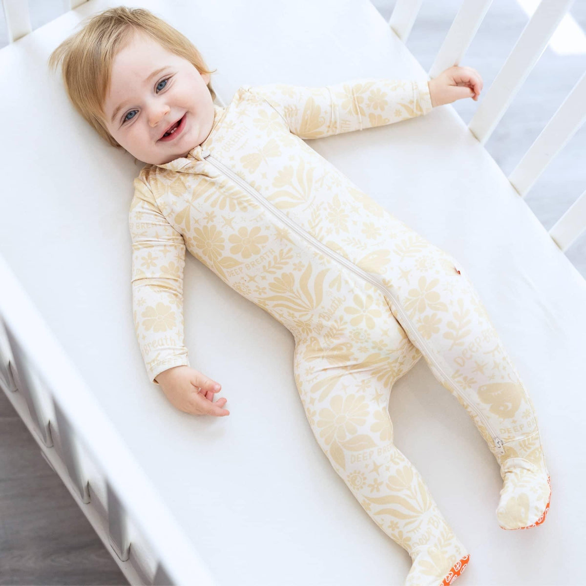 Raising Mama Beige Baby Footie Onesie with Floral Print - The Palm Beach Baby