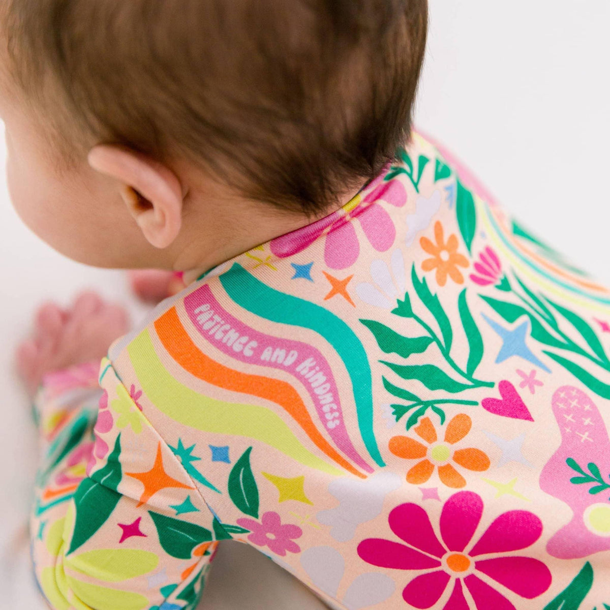 Raising Mama Rainbow Daisy Baby Footie - Colorful Floral Baby Romper - The Palm Beach Baby