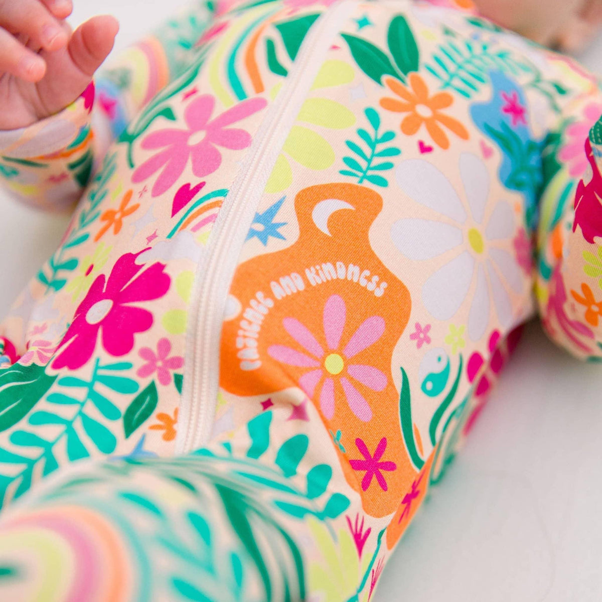 Raising Mama Rainbow Daisy Baby Footie - Colorful Floral Baby Romper - The Palm Beach Baby