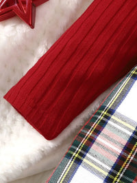 close-up of red sleeve and red plaid girls dress fabric for toddlers