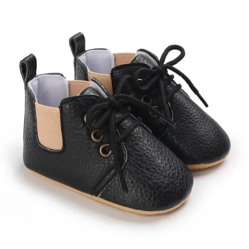 black retro baby lace-up shoes for infants with textured leather and soft beige elastic sides