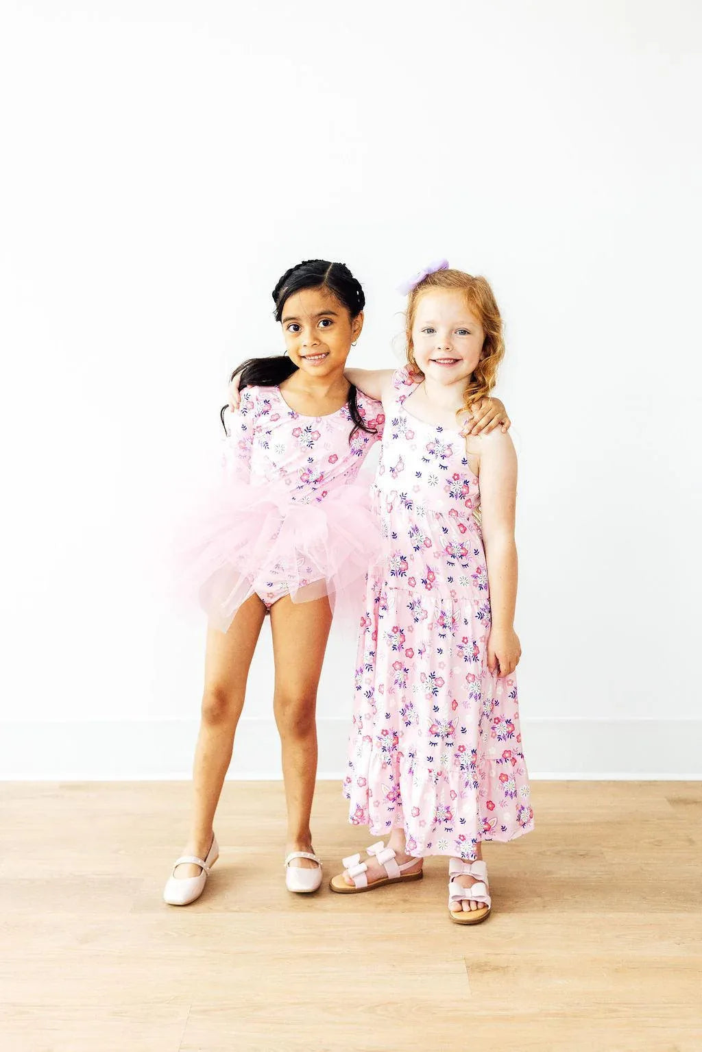 Pink retro tutu leotard for little girls ages toddler to young child with floral pattern and 3/4 sleeves
