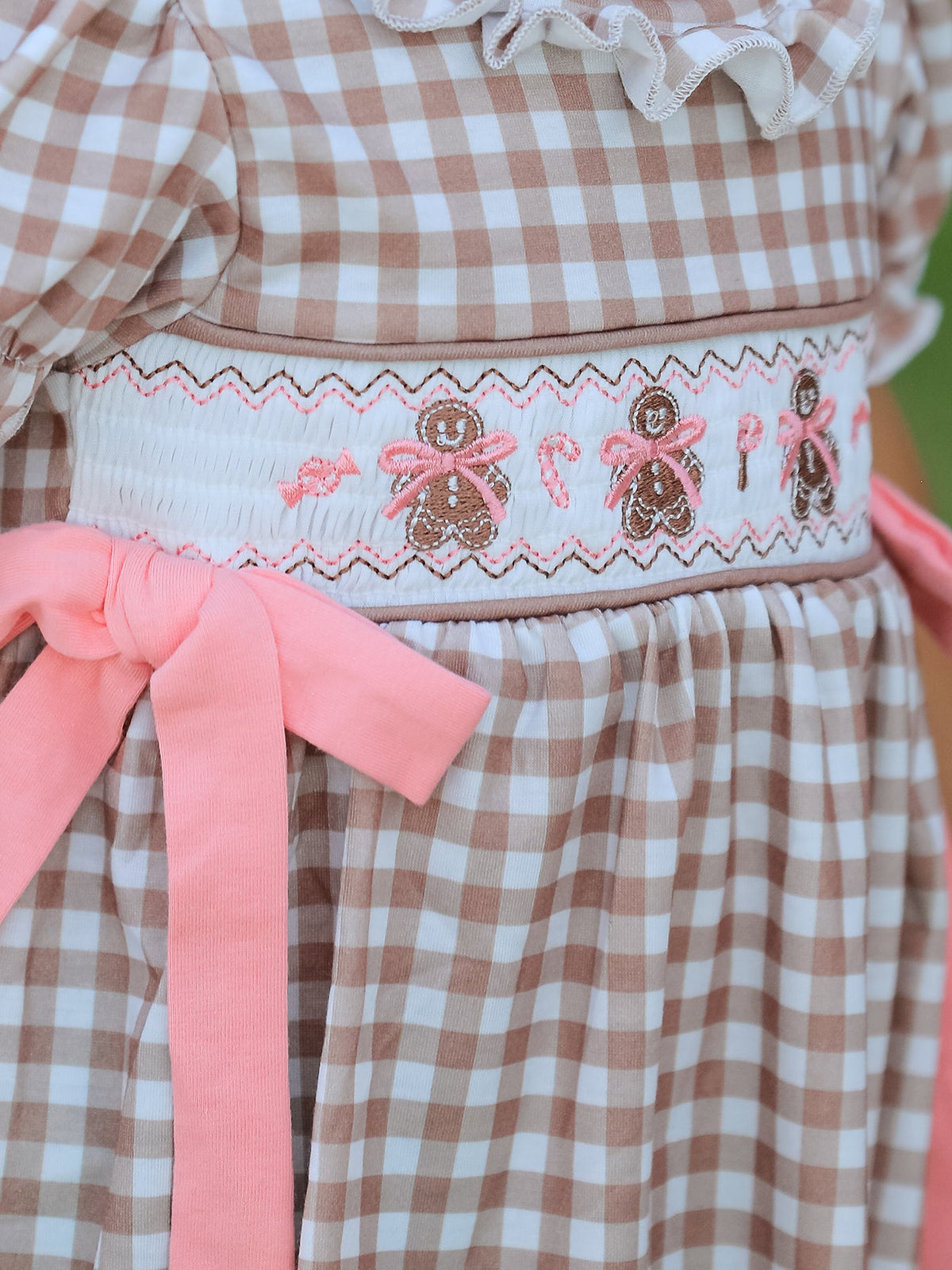 Christmas vintage-style plaid dress with embroidered gingerbread, pink bows, and a smocked waist.