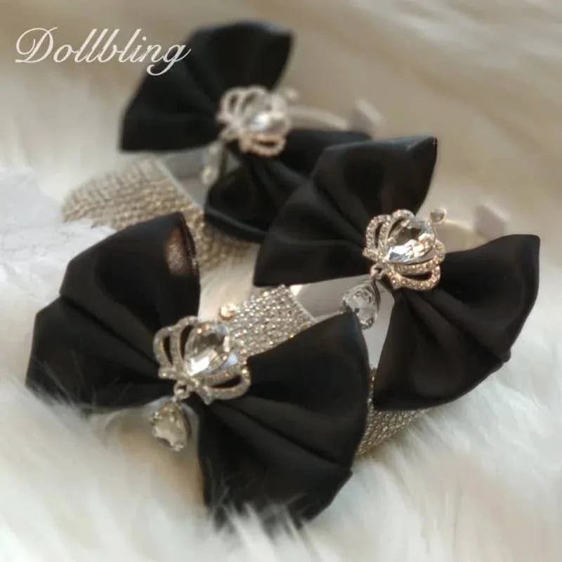 Black rhinestone first walker baby shoes with elegant bows and jeweled crown detail for infants