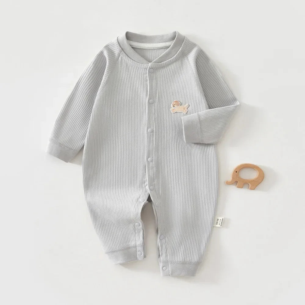 Light gray ribbed knit baby romper made of soft cotton with long sleeves and snap closures