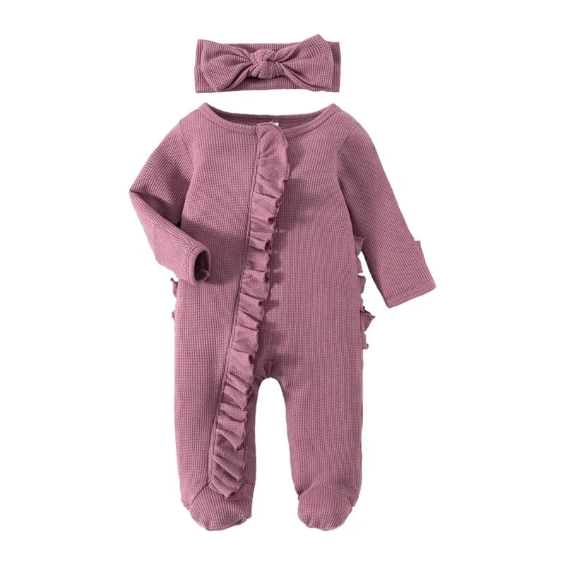 Mauve ribbed knit baby romper with headbow for infants featuring long sleeves and ruffle detail