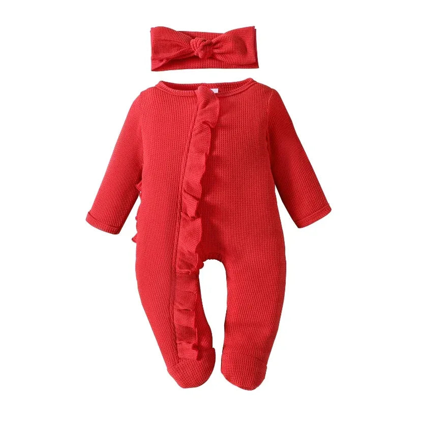 Red ribbed knit baby romper with headbow for newborns featuring long sleeves and ruffle detailing