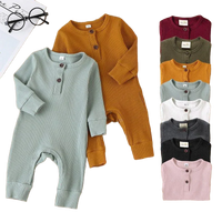 ribbed knit baby toddler romper in mustard yellow and light blue with long sleeves and button detail