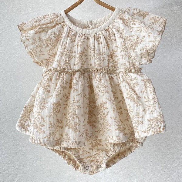 baby girls cream romper with beige floral print and short puff sleeves