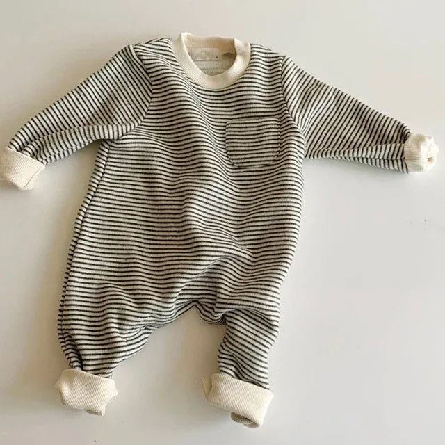 baby striped romper in black and white with long sleeves and chest pocket for infants