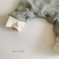 Babies striped romper in black and white with snap buttons and ribbed cuffs for easy dressing