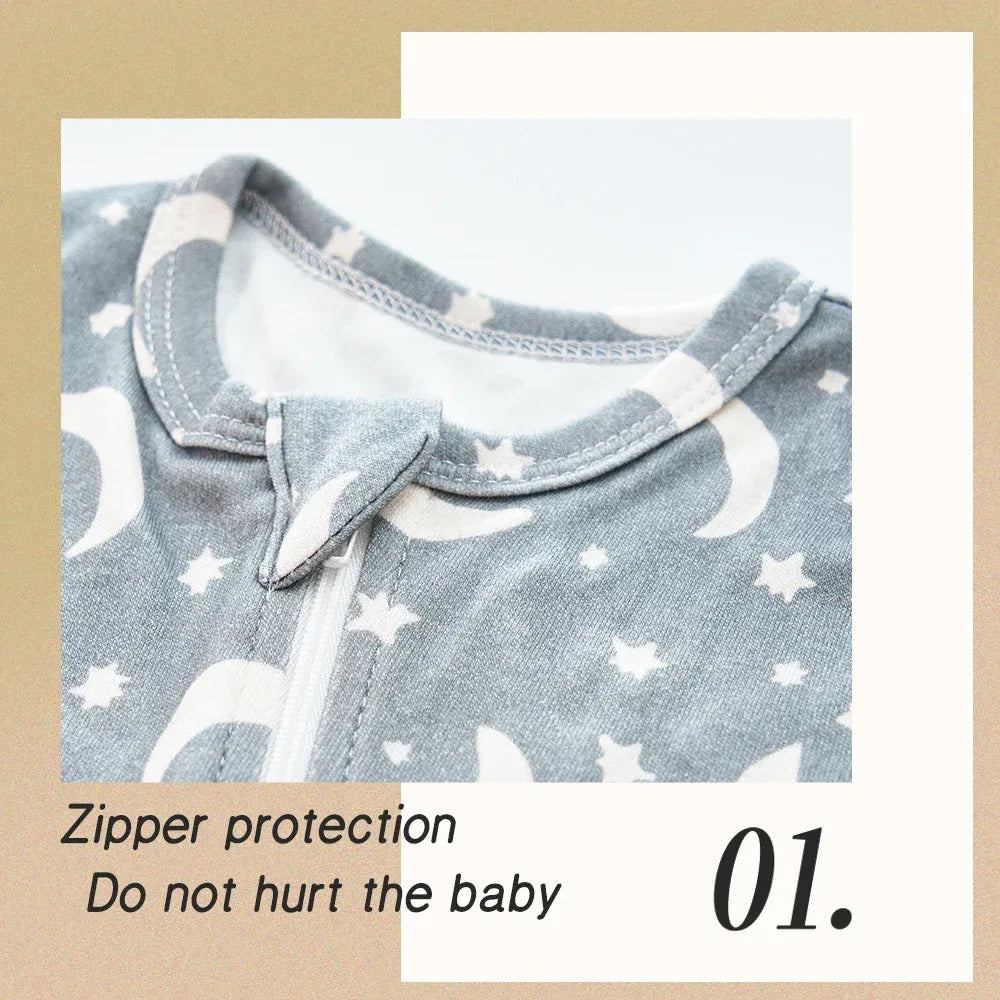 baby romper in gray with white moon and star print and zipper protection for newborns