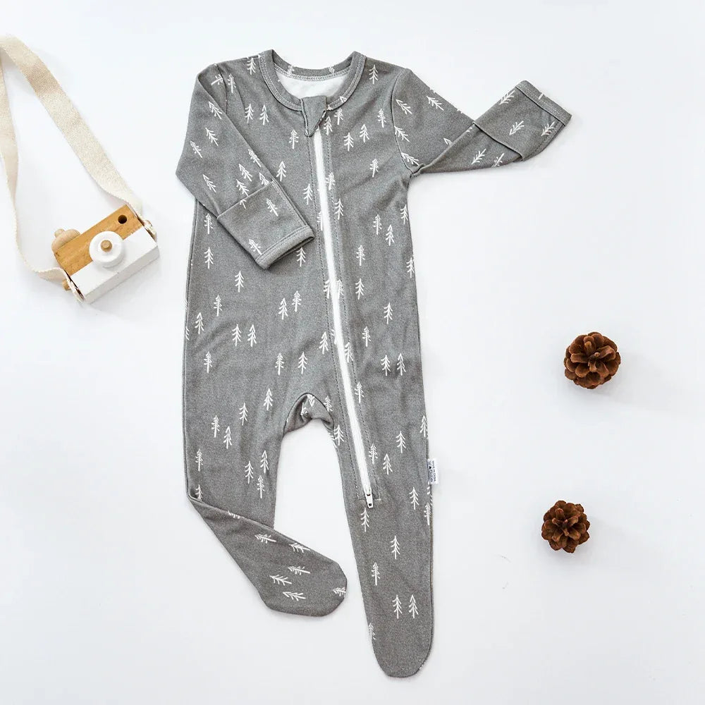 Gray baby romper with white tree print, long sleeve and footed design for infants