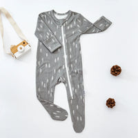 Gray baby romper with white tree print, long sleeve and footed design for infants