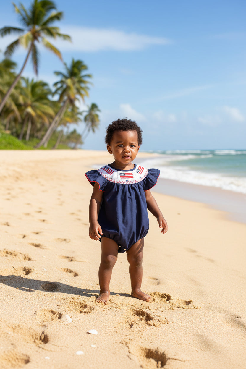 baby navy blue romper with American flag embroidery and ruffle sleeves