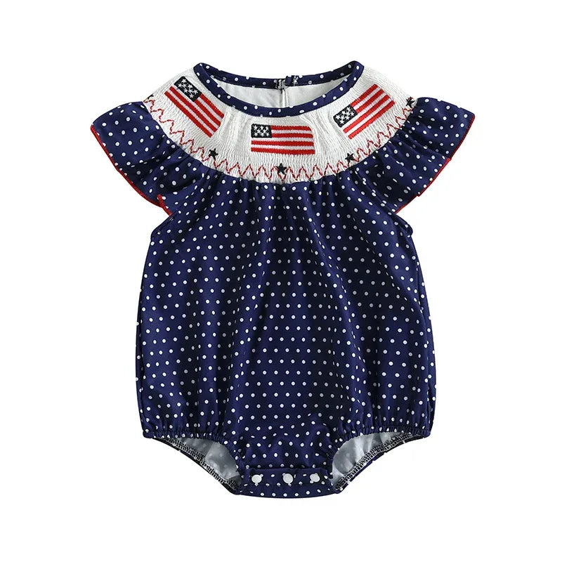 baby navy blue romper with white polka dots and American flag embroidery on yoke