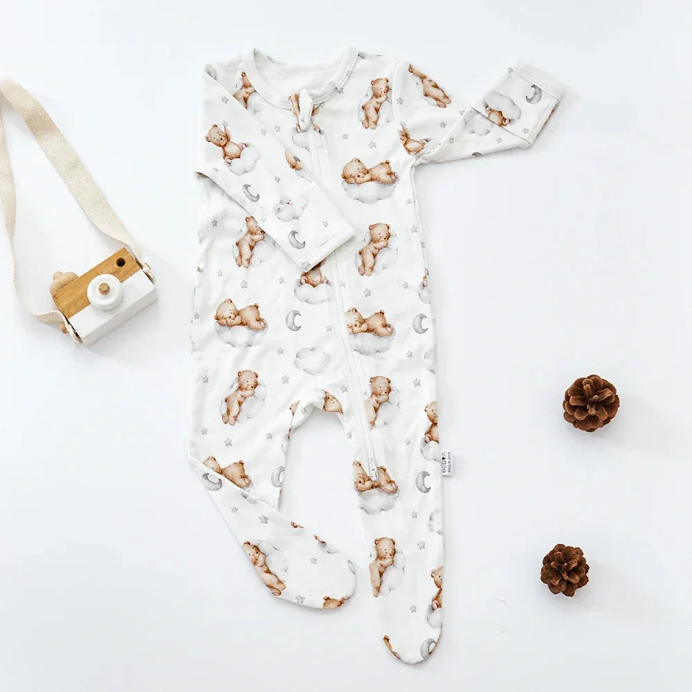 White baby romper with brown teddy bear and moon print, long sleeve footed for infants