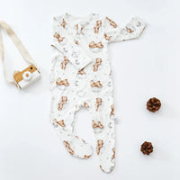 White baby romper with brown teddy bear and moon print, long sleeve footed for infants