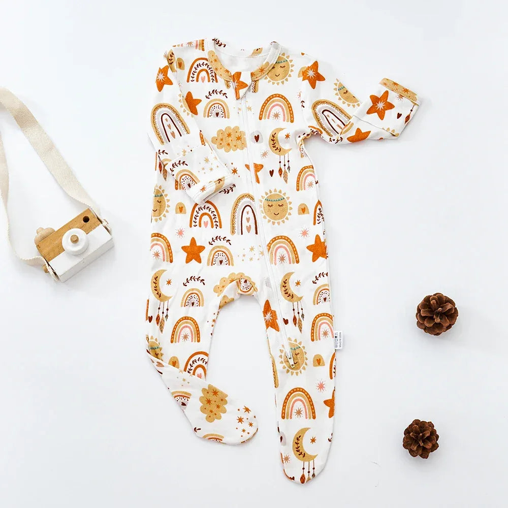 baby romper with white base and orange sun moon stars rainbow print long sleeve footed