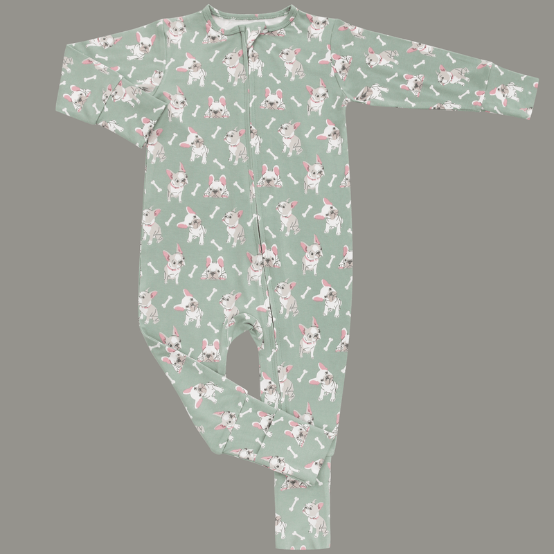 Baby onesie with dog pattern on a gray background