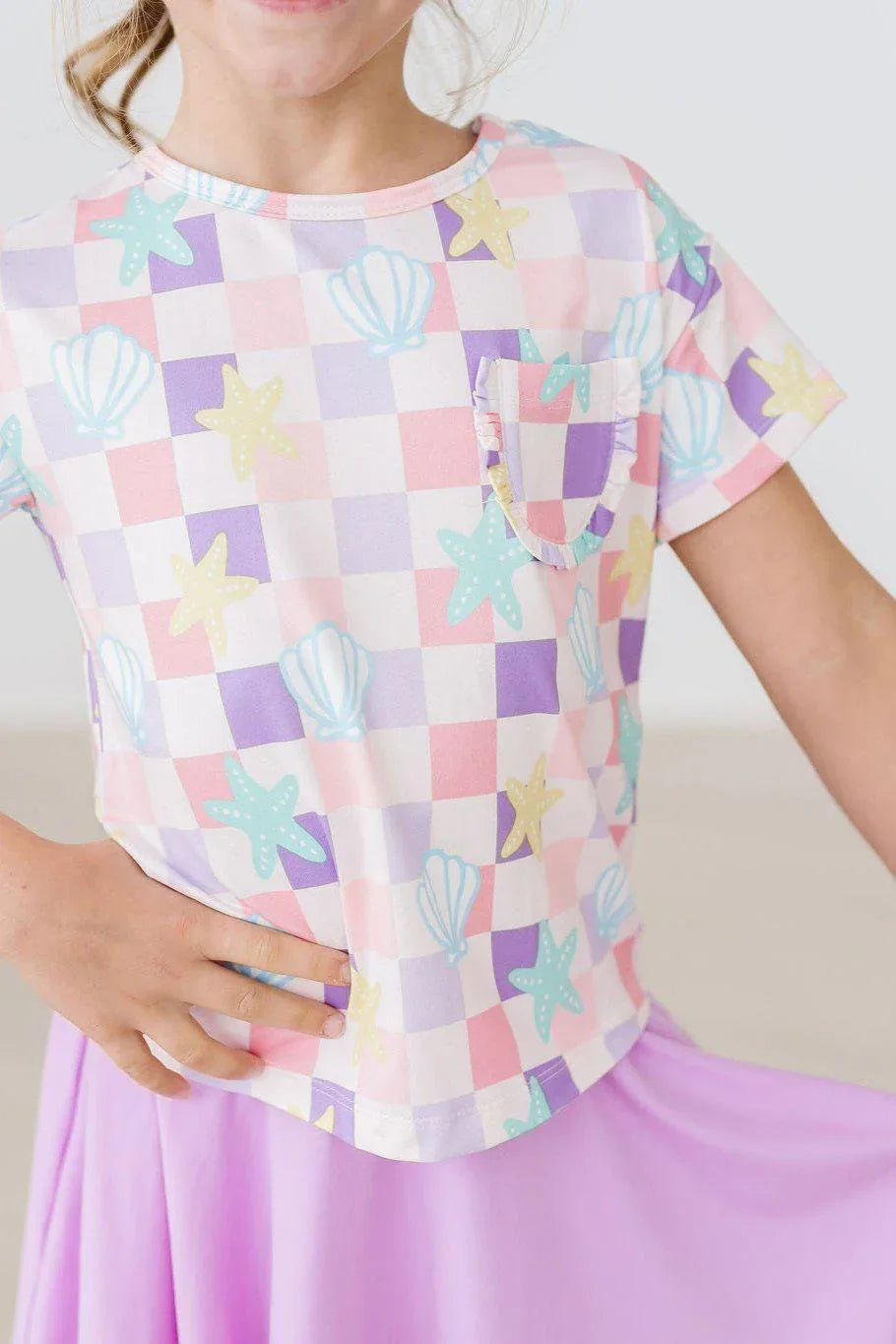 Girls pastel check ruffle pocket tee with seashell and starfish print in size small