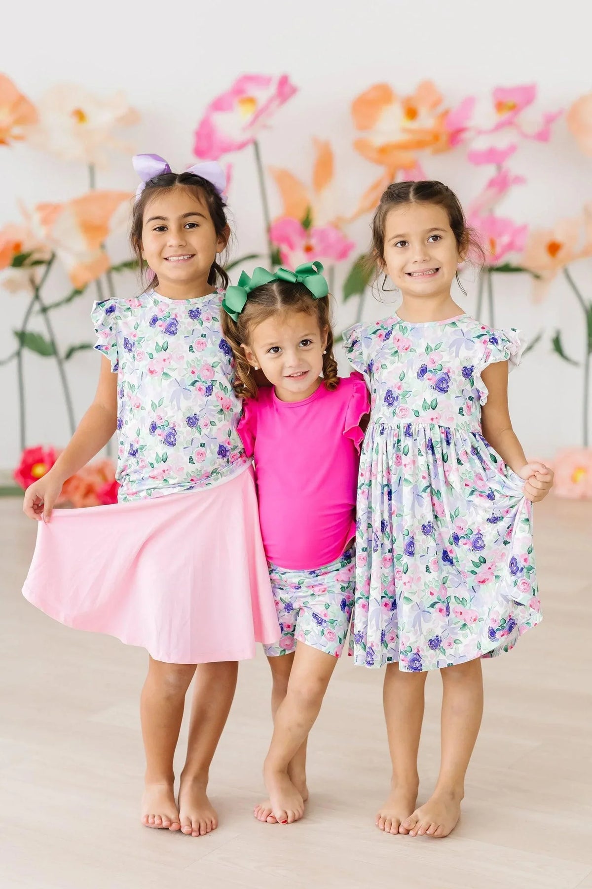 Girls floral ruffle tee short sleeve in white and purple with varying skirt and shorts outfits