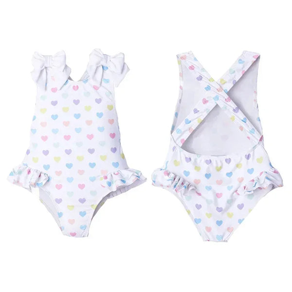 White ruffled heart print toddler swimsuit with pastel hearts and shoulder bows for toddlers