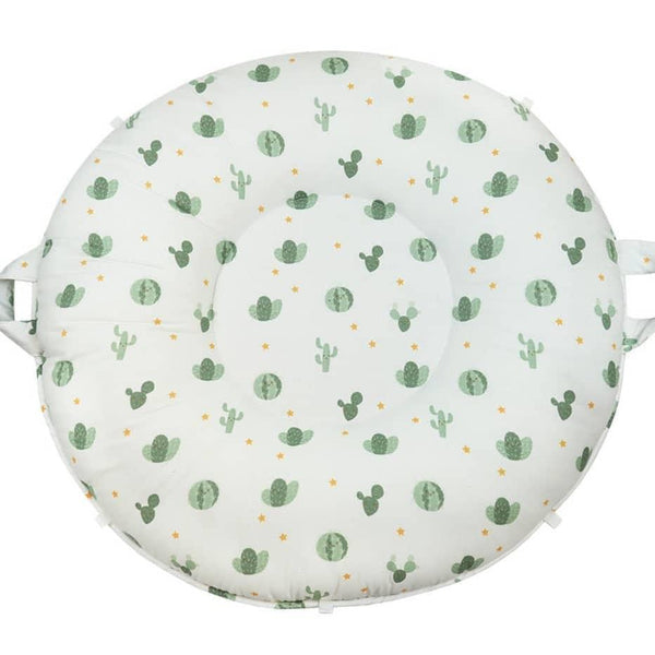 Round sage floor cushion for toddlers with green cactus and watermelon print from Goosewaddle