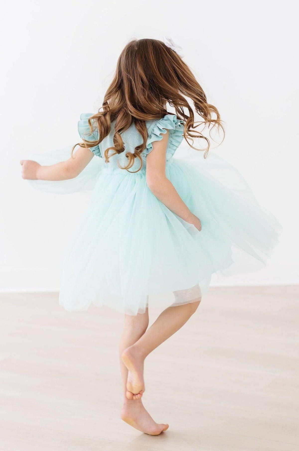 Girls sage shimmer tutu dress with ruffled sleeves by Mila & Rose, perfect for toddlers and young girls