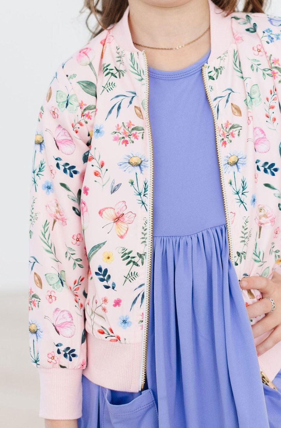 Girls pink floral satin jacket with zipper and long sleeves featuring colorful flower and butterfly print
