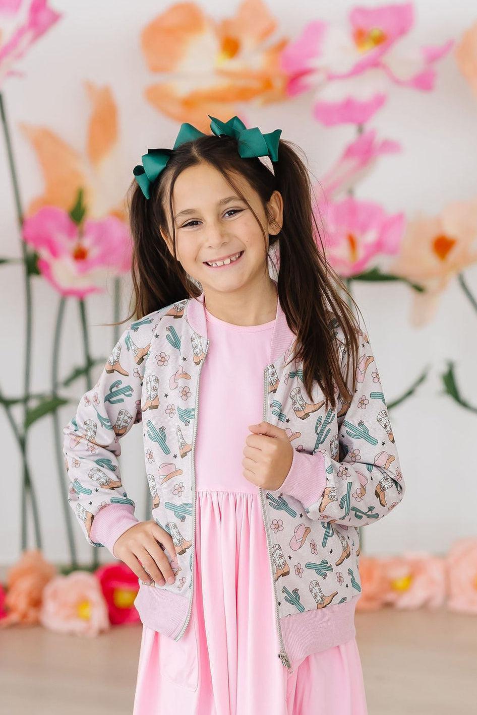Girls light pink satin jacket with cactus print and ribbed cuffs in size small