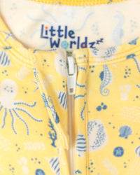 Yellow bamboo toddler romper featuring blue sea creature print and front zipper detail for comfortable sleepwear.