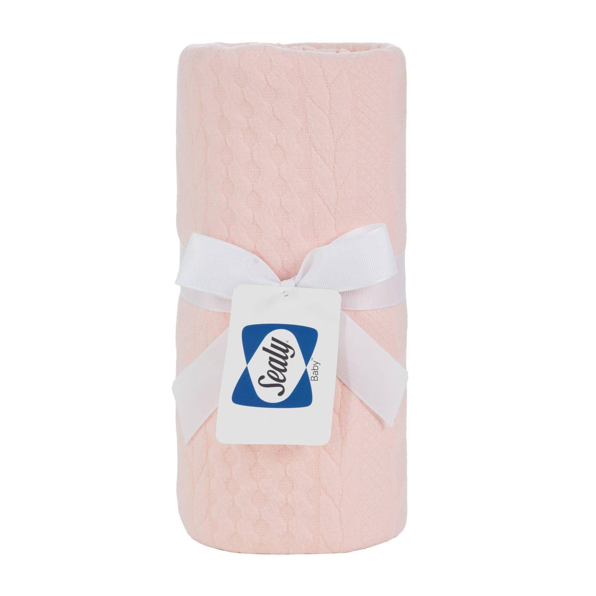 Sealy baby knit blanket apricot rose color made of soft knitted fabric with a white ribbon tied around it