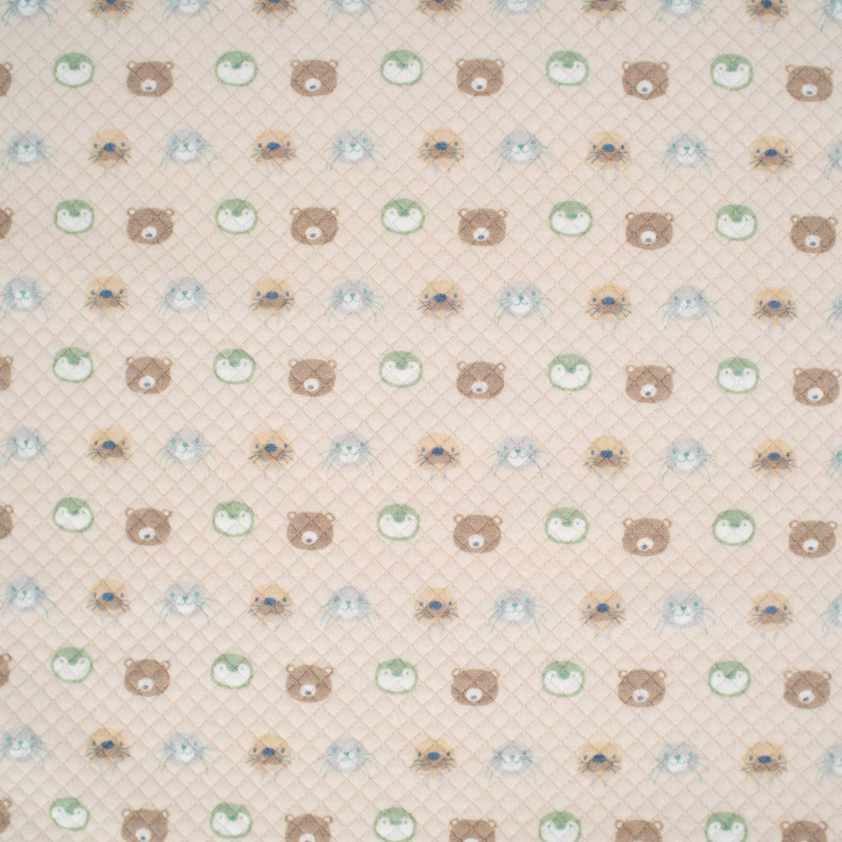 Beige newborn baby Sealy baby knit blanket with quilted texture and cute bear and animal face pattern